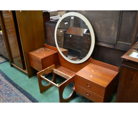 An oak gentleman's wardrobe; a retro teak dressing table and stool by Uniflex International Furniture. (3)
