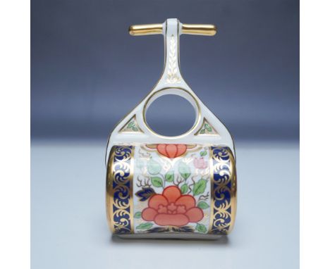 This exquisite Royal Crown Derby Mini Garden Roller figurine showcases the intricate Lotus Blossom pattern, adorned with vibr