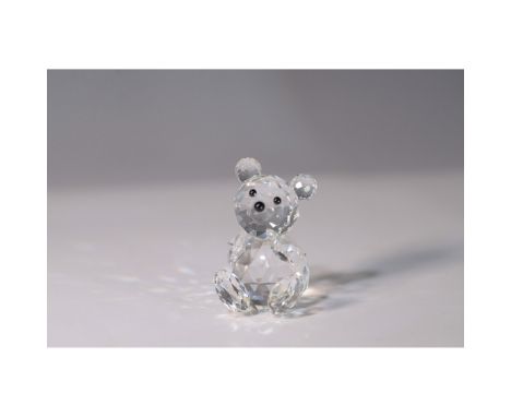 Swarovski Small Bear (item 010004), features a faceted clear crystal body with black crystal eyes and nose. Part of the Woodl