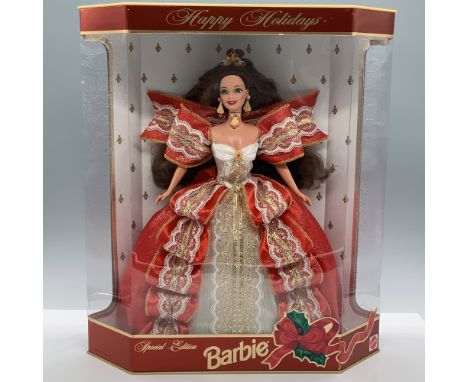 Dressed in a red ribbon and white lace dress with gold-colored accents, wearing a tiara and jewelry with red crystals. 10th A