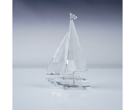 Swarovski crystal figurine of a sailboat from the When We Were Young collection. Crafted from faceted clear crystal, this ele