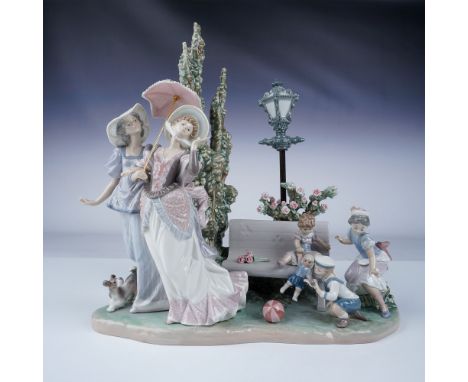 Glossy finish. This beautiful Lladro porcelain figurine captures a playful, elegant scene of children and women in a charming