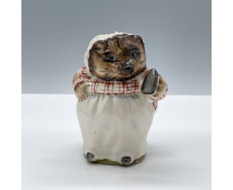 Glossy porcelain. The character is modeled in white and red patterned clothes. Beswick Beatrix Potter backstamp. This item ha