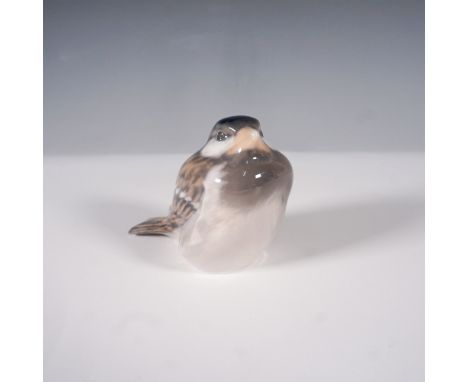 This Royal Worcester figurine features a delicately crafted Sparrow, captured in a naturalistic pose. The bird is beautifully