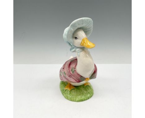 This beloved figure is hand painted in bright colors of rose, green and yellow. Dressed in her shawl and hat. Beswick Beatrix