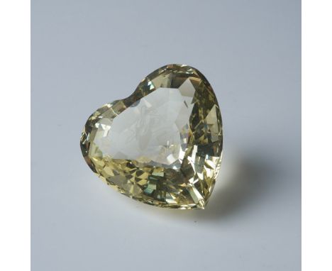 Swarovski 2004 Event heart crystal figurine featuring a vibrant yellow hue. This special edition heart showcases a pair of ba