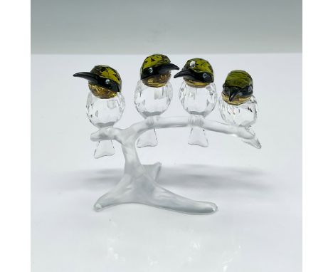 This stunning Swarovski Bee-Eaters figurine, designed by Elisabeth Adamer, beautifully captures the elegance and vibrancy of 