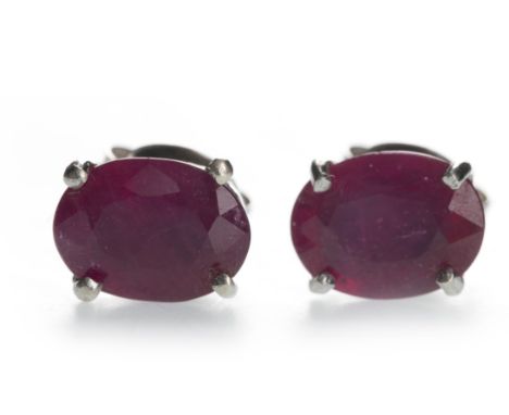 PAIR OF TREATED RUBY EARRINGS, each set with an oval treated ruby, marked 925 to the posts, 1.6g