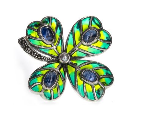 PLIQUE A JOUR FOUR LEAF CLOVER BROOCH, set with four cabochon sapphires bordered by green enamel, with central seed pearl and