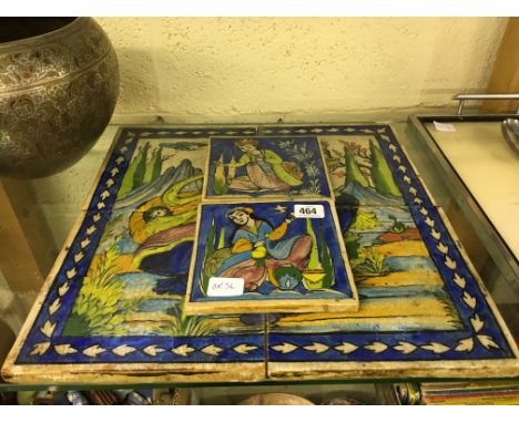 A four tile Eastern panel decorated with a female figure holding a bottle and tea bowl together with two similar tiles.