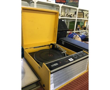 A mid 20th century yellow ITT KB (KolsterBrandes) record player with Garrard Model 2025 deck.
