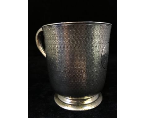A Victorian engine turned silver Christening mug (153 grams).