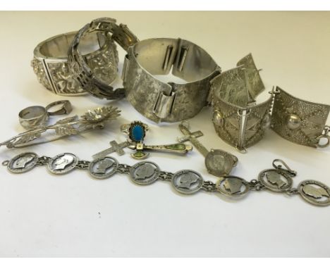 A carton containing an Indian silver bangle together with other silver jewellery items.