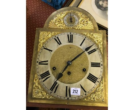 A longcase clock movement with brass and silver metal dial.