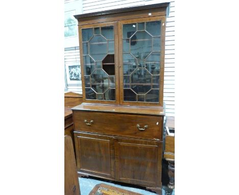 Georgian mahogany secretaire bookcase, the moulded cornice above astragal-glazed door enclosing shelves, pull-out fitted draw