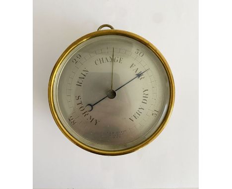 Early 20th century brass cased barometer by C.W. Dixey &amp; Son (London), with silvered dial and loop for suspension, 13.3 c