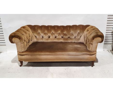 Late Victorian Chesterfield-style sofa in brown upholstery, raised on castorsCondition ReportHeavy fading and discolouration,