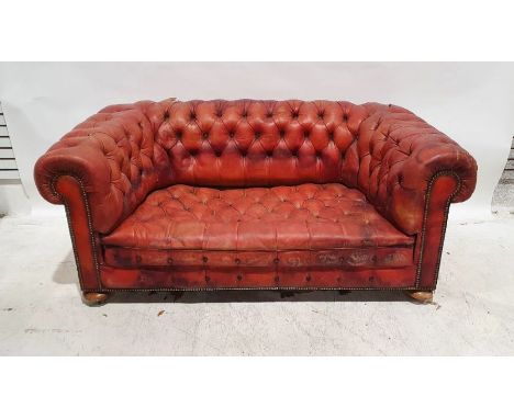 Chesterfield sofa&nbsp;in red leather button-back upholstery, squat bun feet&nbsp;