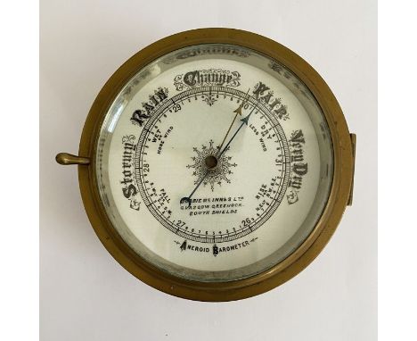 Early 20th century brass cased aneroid barometer by Dobbie McInnes (Glasgow), with hinged glazed case, 17cm diam.&nbsp;