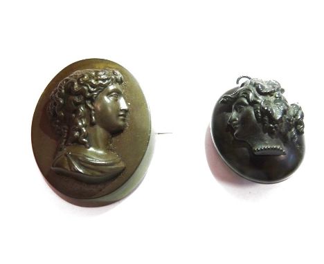 Carved jet pendant locket, oval with classical profile in relief and a bois durci classical female portrait brooch (2)Conditi
