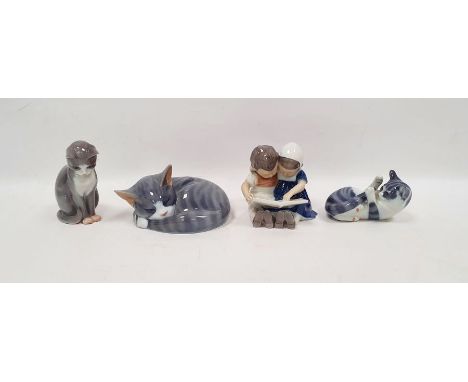 Three 20th century Royal Copenhagen models of cats and a figure group, printed green marks, blue wave mark, the larger cat mo