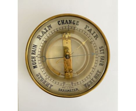 Early 20th century French brass skeleton barometer, with glass front and gilt metal mechanism marked Brevet/ 49842, 20.5 cm d