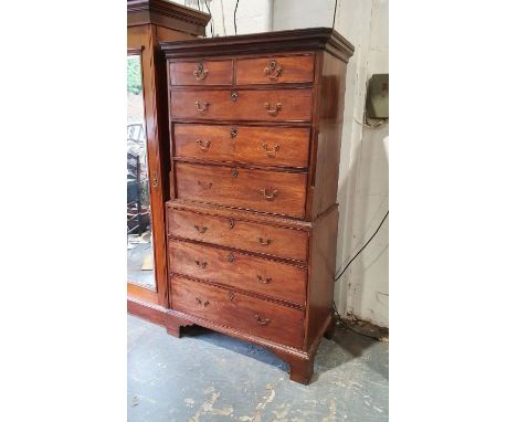 Georgian mahogany chest on chest, the moulded cornice above two short over three long drawers, canted corners, on a base of t