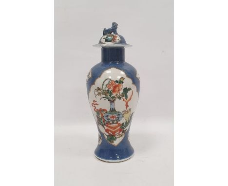 Chinese vase&nbsp;with Kangxi mark to base, the lidded top with Dog of Fo finial, the powder blue ground body with panels of 