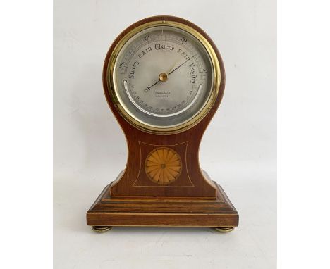Georgian style inlaid mahogany Finnegans Ltd (Manchester) barometer,&nbsp;the silvered dial mounted with thermometer, in shap