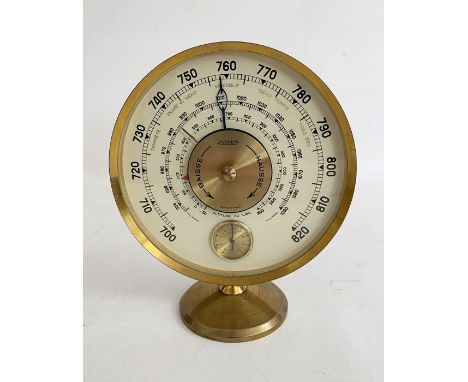 Mid-20th century Jaeger desk barometer, in gilt metal case of circular form with cream coloured dial, with brass thermometer,