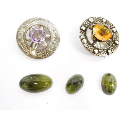 Scottish silver and amethyst brooch set single cut stone and a similar Celtic-pattern brooch set cut citrine and three polish