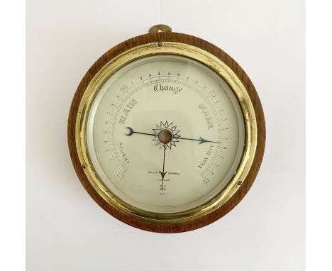 Oak cased Negretti & Zambra (London) aneroid barometer, the silvered dial marked R/1298, 17.2cm diam. 
