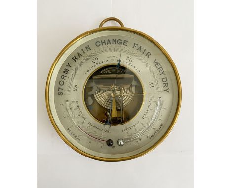 Late 19th century French brass cased skeleton holosteric barometer, the silvered dial marked PHNB for Naudet, with a centigra
