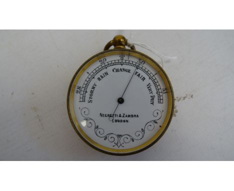 Negretti & Zambra of London pocket barometer with white enamel dial, 4.7cm diameter