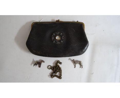 Small vintage handbag with a miniature clock inset to the interior showing the face on the outside of the bag, with faux-pear