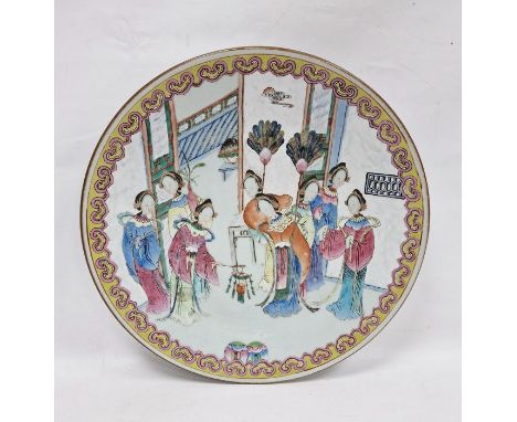 Late 19th century Chinese porcelain charger, painted in the famille rose palette with figures of attendants before terracing 