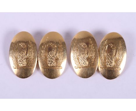 A pair of 18ct gold cufflinks, engraved crest of a Phoenix, 9.1g