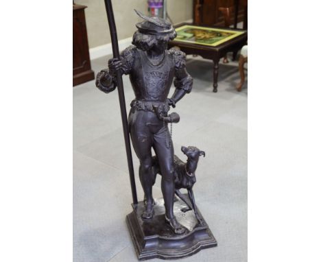 An anodised standard lamp, in the form of a Renaissance hunter with dog, 59" high