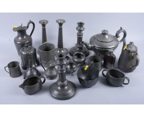 Two pairs of pewter candlesticks, a pewter tea caddy, a pewter teapot and other pewter