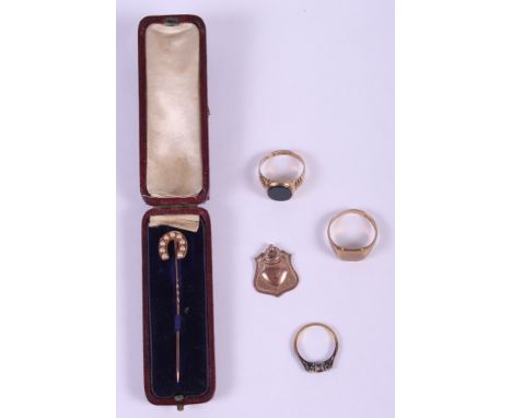 An 18ct gold, ruby and diamond dress ring (one stone missing), two 9ct gold signet rings, a 9ct gold medallion, and a Victori