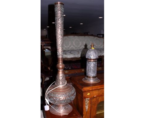 A pierced and engraved copper "sprinkler bottle" shape floor lamp, 42" high, and a smaller, similar pierced silvered lamp, 16