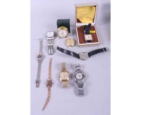 An Angelus gilt travelling alarm clock with white enamel dial and baton numerals, in fitted green case, a Sekonda wristwatch,