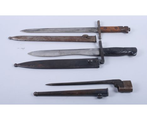 An early 20th century bayonet with metal scabbard, 11 3/4" long and a nail bayonet and a later Spanish bayonet