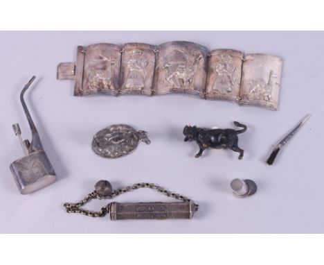 A Chinese white metal miniature pipe, a white metal miniature scroll holder, three white metal bowls and various other white 