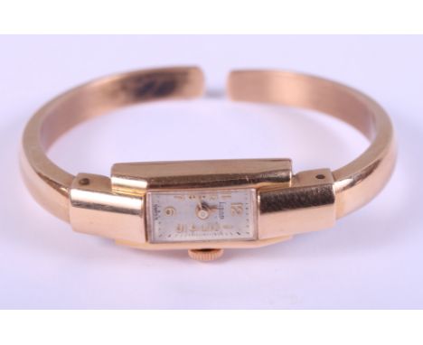 A lady's 18ct gold Siban bracelet watch with champagne dial and Arabic numerals, 16.8g gross