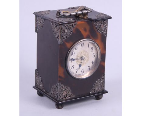 An Edwardian tortoiseshell and silver mounted carriage clock with striking movement, 5" highCondition: Loss to middle of top 