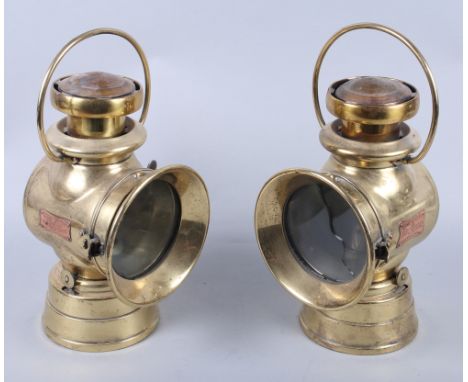 A pair of brass Lucas "King Road" car lamps (glass damaged on one lamp), 10 1/2" high