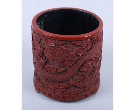 A Chinese cinnabar lacquer brush pot with dragon decoration and seal mark to base, 5 1/4" high