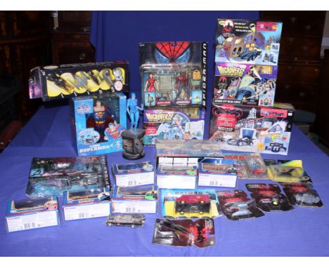 A Kenner Batman and Robin Batcave Micro Playset, a Microverse Gotham City Micro Playset, a DC die-cast model of the Batmobile