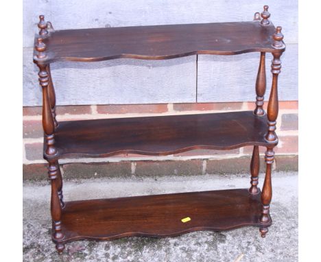 A mahogany three-tier open wall shelf, 24" wide, a mahogany wine table, and a magazine rack